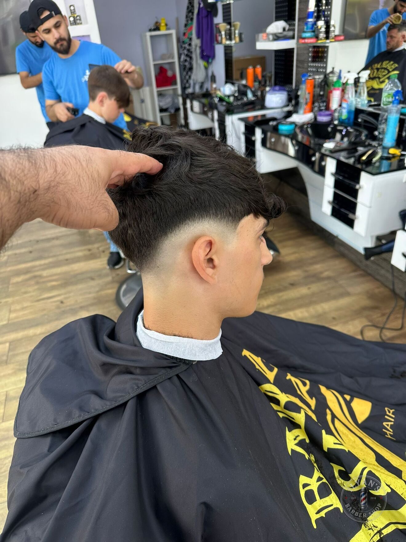 Textured Crop with Mid Skin Fade at Ilyan's Barber Shop