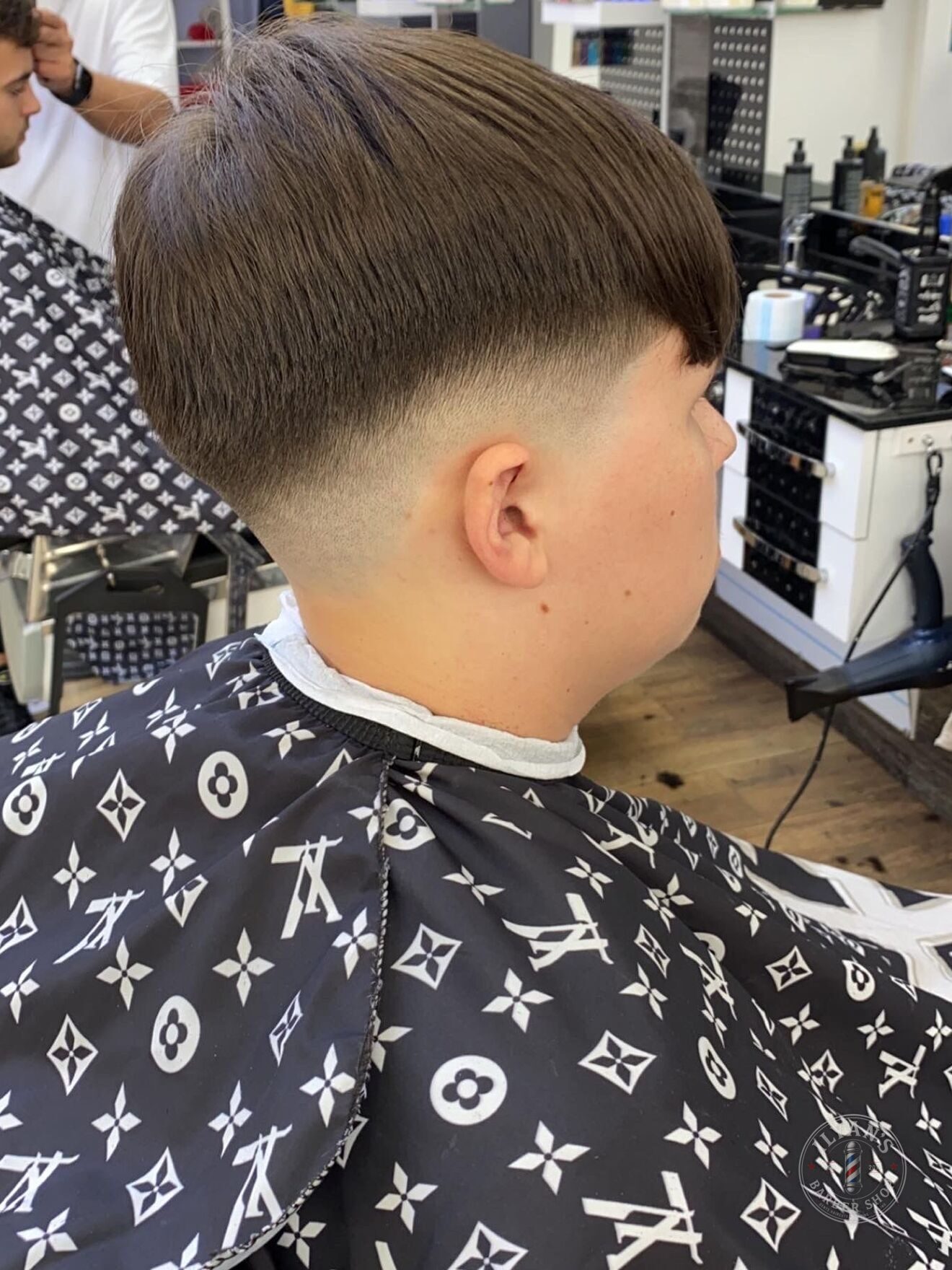 Curtains with Low Fade at Ilyan's Barber Shop